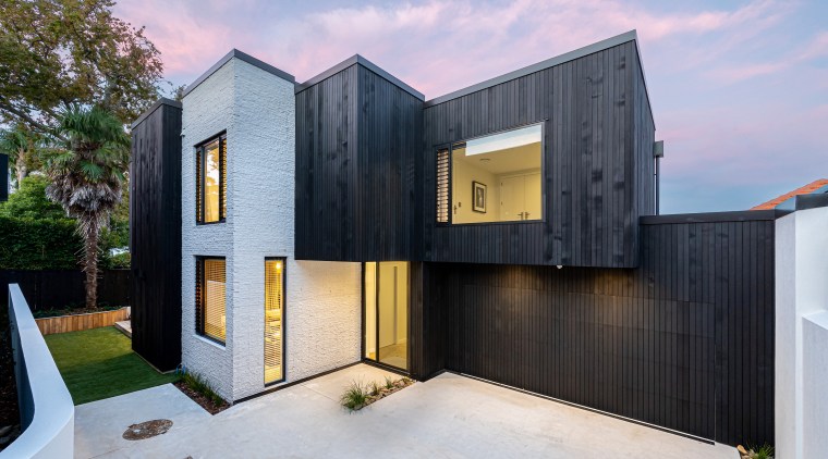 Striking two-tone cladding is part of teh home's 