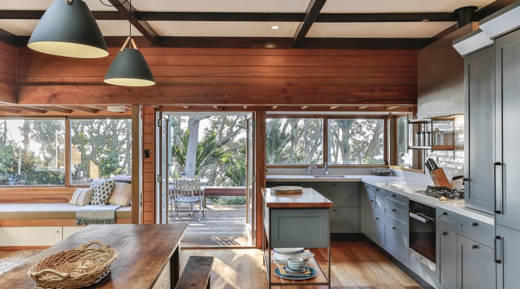 While this overall kitchen space is quite compact, architecture, beam, building, cabinetry, ceiling, countertop, daylighting, floor, flooring, furniture, hardwood, home, house, interior design, kitchen, lighting, loft, property, real estate, room, table, window, wood, wood flooring, wood stain, gray, brown