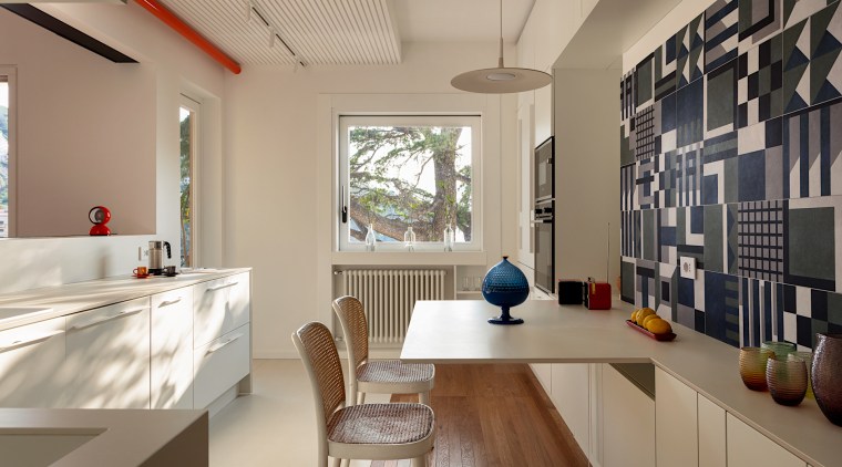 The kitchen is divided into two areas of 
