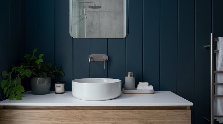 The bathroom balances a sense of serenity with 