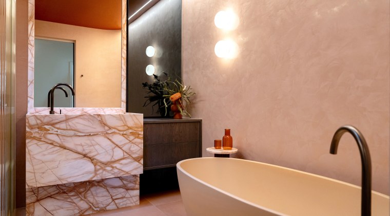 The beautifully plastered wall offers a balancing counterpoint 