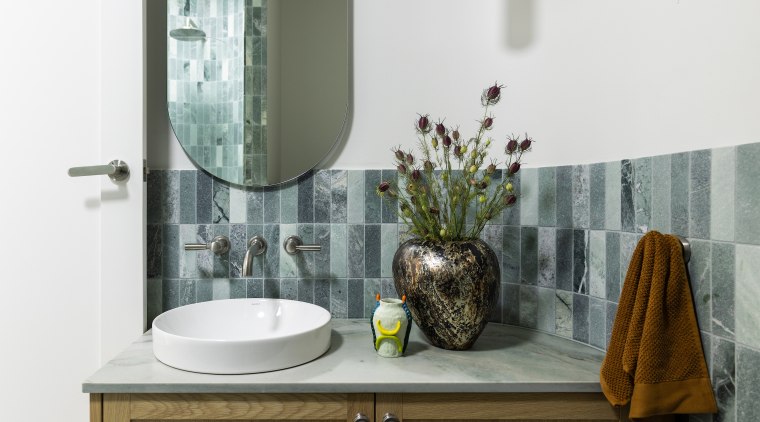 Although compact, the guest ensuite achieves a sense 