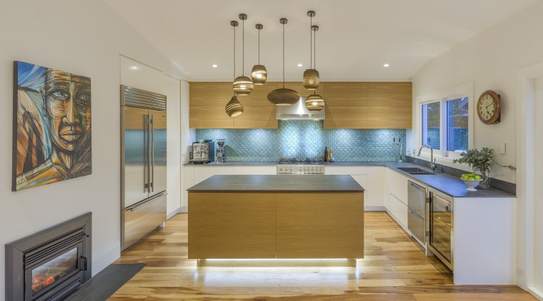 ​​​​​​​The iridescent splashback draws the eye in this architecture, building, cabinetry, ceiling, countertop, dining room, estate, floor, flooring, furniture, hardwood, home, house, interior design, kitchen, light fixture, property, real estate, room, wood, wood flooring, yellow, gray