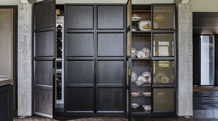 The working pantry zone houses hidden appliances including 