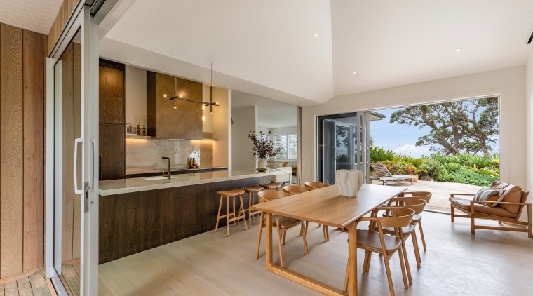 The kitchen and dining areas enjoy open indoor-outdoor 