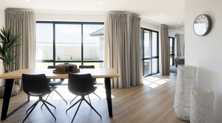 This generous, contemporary showhome by GJ Gardner Homes, apartment, building, ceiling, chair, dining room, floor, flooring, furniture, hardwood, home, house, interior design, laminate flooring, living room, property, real estate, room, table, wood flooring, white, gray
