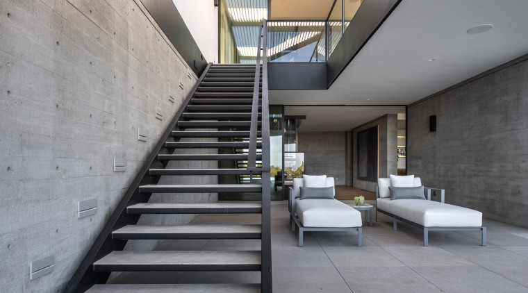 Metal stairs and concrete surfaces create a semi-industrial 