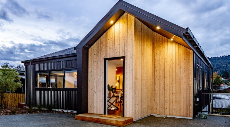 Corrugated iron and timber create a rugged skin 