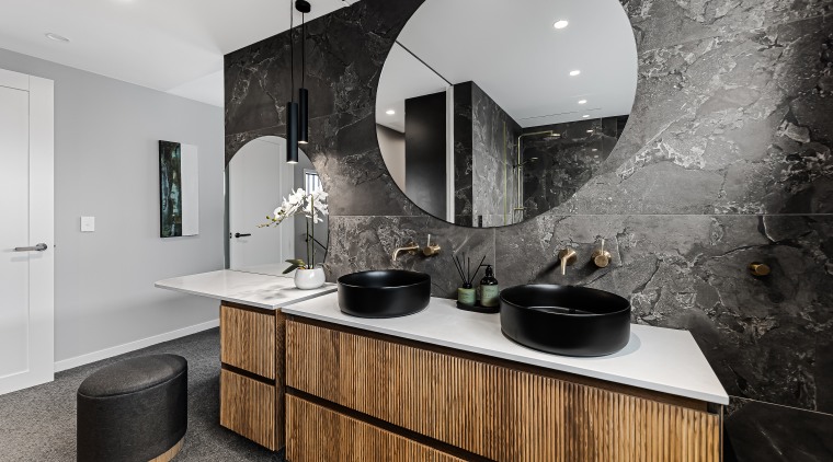 Two custom-made round mirrors are a standout feature, 