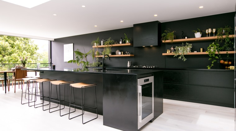 ​​​​​​​In this kitchen by architect Evelyn McNamara, Resene countertop, interior design, kitchen, white, black