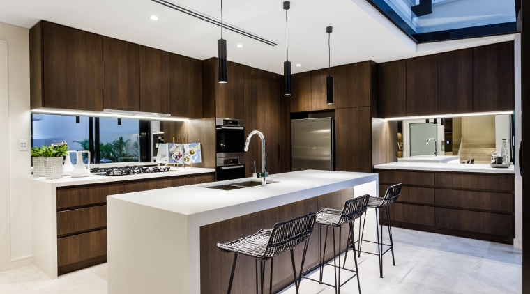 Mirror splashbacks add to the sense of space cabinetry, countertop, cuisine classique, interior design, kitchen, white, black