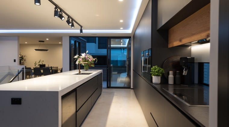 This kitchen is constrained by floor-to-ceiling glass doors architecture, countertop, benchtop, house, interior design, kitchen, black, di Rosa Cabinetry & Furniture