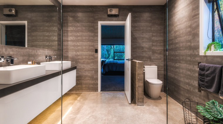 ​​​​​​​A low raw concrete nib wall provides some bathroom, floor, flooring, interior design, tile, gray, master suite, Kirsty Davis, vanity, shower