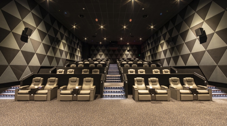 The EntX Entertainment Centre has quiet, warm cinemas auditorium, flooring, function hall, interior design, black, brown
