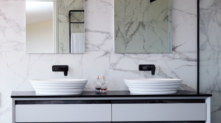 This custom his-and-hers vanity, supplied locally by Elite architecture, bathroom, bathroom accessory, building, cabinetry, ceiling, countertop, floor, flooring, furniture, home, house, interior design, material property, plumbing fixture, property, room, sink, tap, tile, wall, white, gray