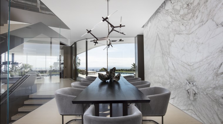 The dining space is at the centre of architecture, building, ceiling, coffee table, design, dining room, floor, furniture, home, house, interior design, living room, property, real estate, room, table, gray