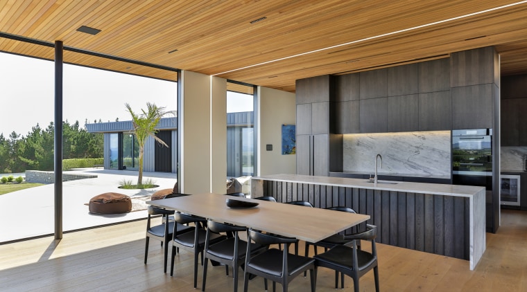 ​​​​​​​Stained wood meets white granite in this kitchen 