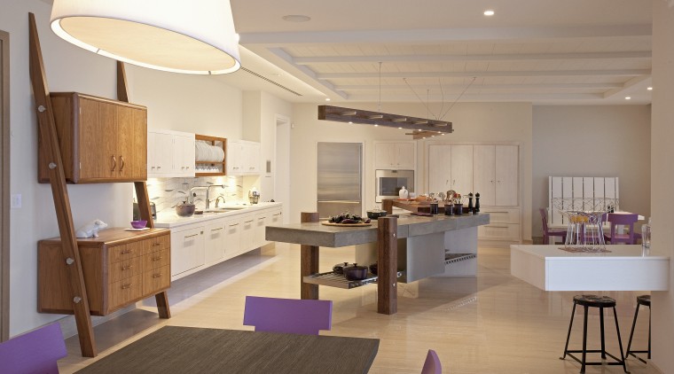 The cook(s) should have a view of the architecture, building, cabinetry, ceiling, countertop, design, dining room, floor, flooring, furniture, home, house, interior design, kitchen, lighting, living room, loft, material property, property, real estate, room, table, gray, brown