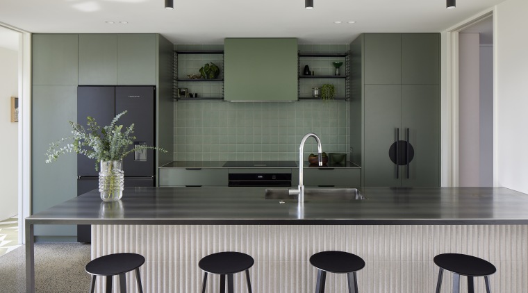 Green is the block colour in the kitchen. 