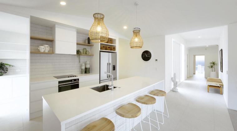 Looking from the well-appointed kitchen across the entry 