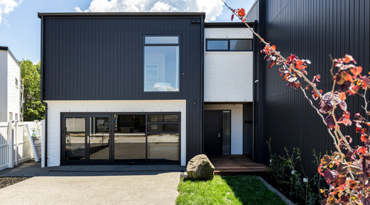 The showhome’s exterior of bold black vertical cladding 