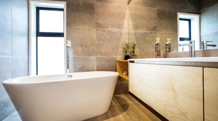 See more of this bathroom hereDesigned by bathroom, floor, flooring, interior design, property, real estate, room, tile, wall, white