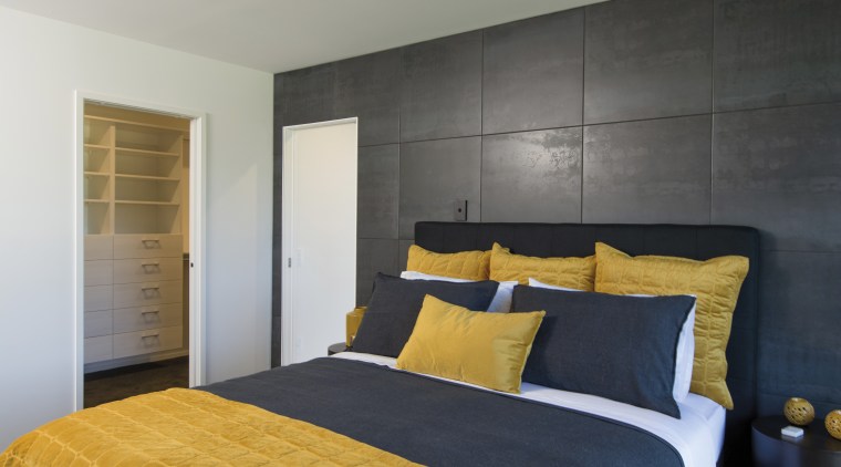 A panelled wall behind the bedhead is a architecture, bed, bedroom, home, interior design, master bedroom, black, mustard, GJ Gardner Homes