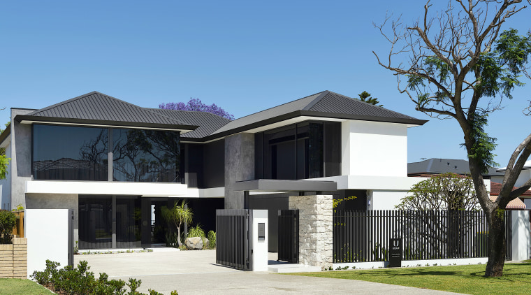 The home's plaster, tinted glass, and stone make 