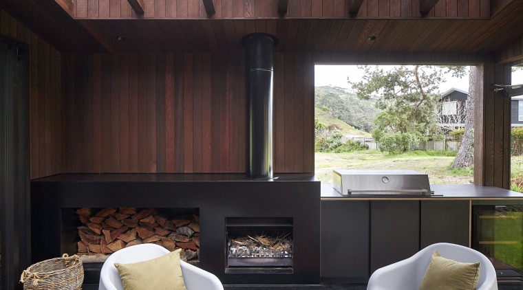 The sheltered outdoor room with integrated BBQ and 