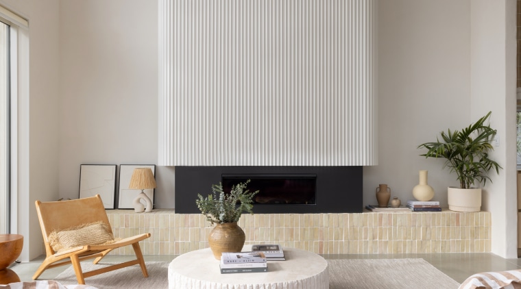 Fluting on the fireplace echoes a similar finish 