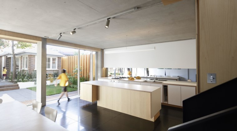 ​​​​​​​This light-filled kitchen by studio203 is built for apartment, architecture, building, ceiling, daylighting, floor, furniture, home, house, interior design, kitchen, loft, property, real estate, room, gray