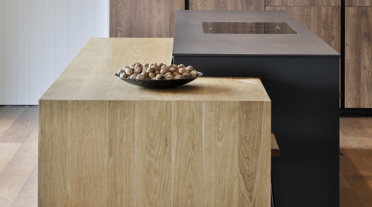 Minimalist pendants throw light on the stepped benchtops. 