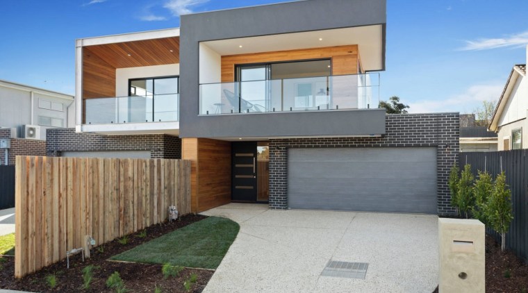 One part of the home is set back architecture, elevation, estate, facade, home, house, property, real estate, residential area, gray