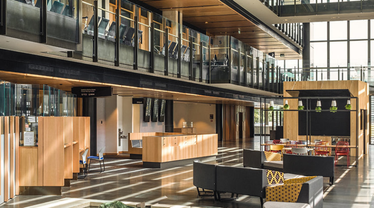 Home to the public cafe, the glass-walled atrium architecture, building, black