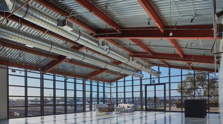The Greenhouse restaurant and event space continues the beam, daylighting, roof, steel, structure, gray