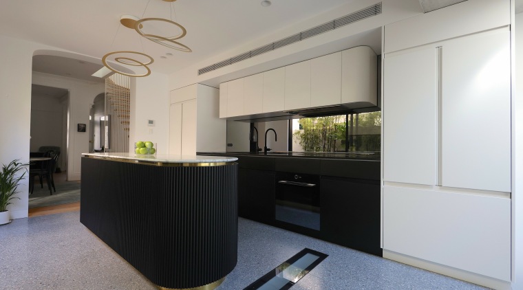 The kitchen is set within the contemporary rear 