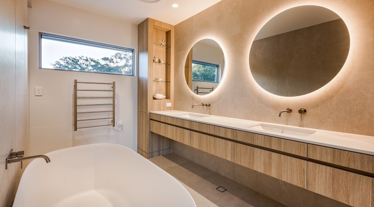 The use of natural stone and timber-look finishes 