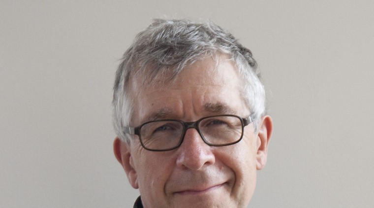 Renowned British kitchen designer, author and educator – businessperson, sitting, gray, black