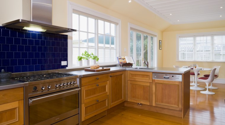 view of a renovated kitchen where Swamp kauri cabinetry, countertop, cuisine classique, floor, flooring, hardwood, home, interior design, kitchen, property, real estate, room, window, brown, gray