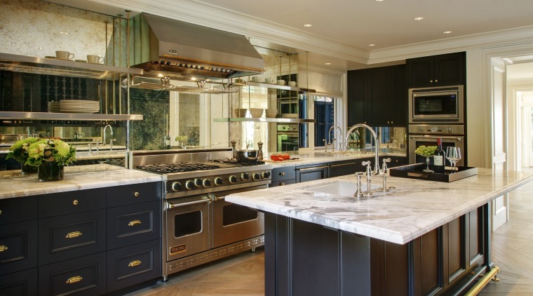 The foyer staircase and walls feature an easily cabinetry, countertop, cuisine classique, interior design, kitchen, room, black, brown, gray