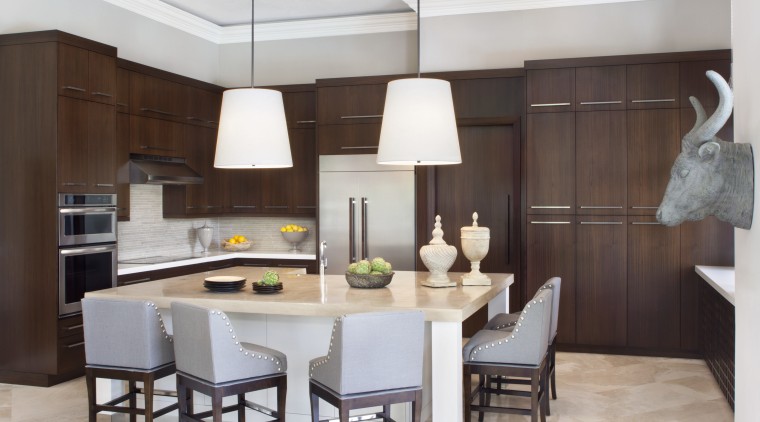 The large island provides ample room for several cabinetry, countertop, cuisine classique, dining room, interior design, kitchen, room, gray