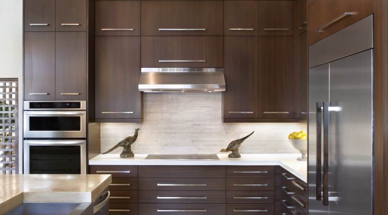 The splashback in this remodelled kitchen features light-toned cabinetry, countertop, cuisine classique, furniture, hardwood, interior design, kitchen, room, wood, brown, gray