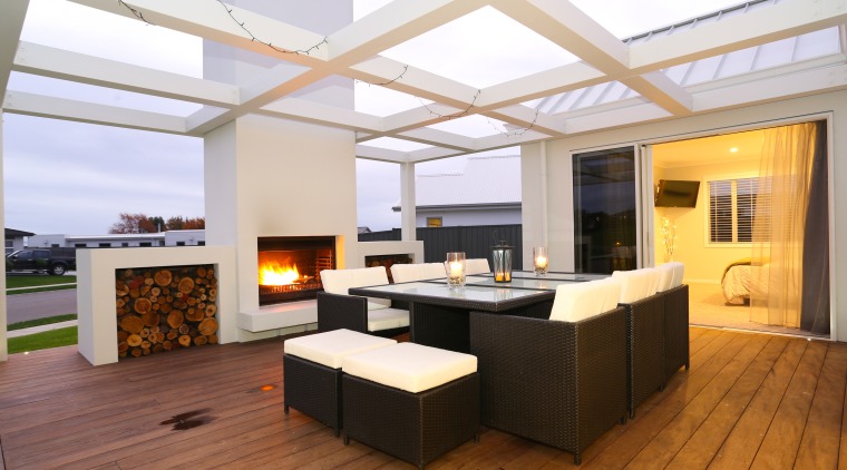 A large outdoor deck with barbecue fire and ceiling, floor, interior design, living room, real estate, white