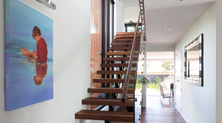 This homes feature walnut, floating staircase is also architecture, daylighting, floor, handrail, house, interior design, product design, stairs, gray