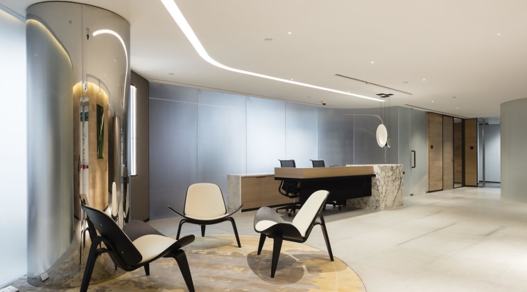 A structural column has been turned into an ceiling, floor, flooring, interior design, lobby, real estate, gray
