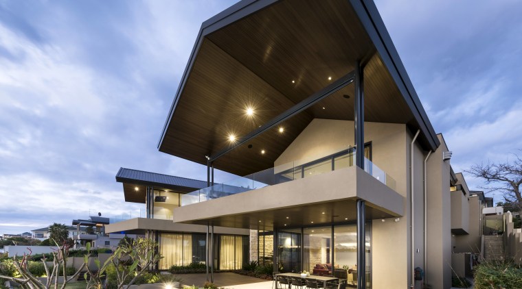 On this home, two semi-cantilevered wings stretch out architecture, building, corporate headquarters, estate, facade, home, house, property, real estate, residential area, sky, teal