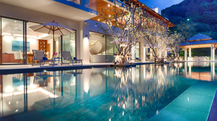 Located in front of the living and dining estate, home, hotel, house, leisure, property, real estate, resort, resort town, swimming pool, vacation, villa, blue