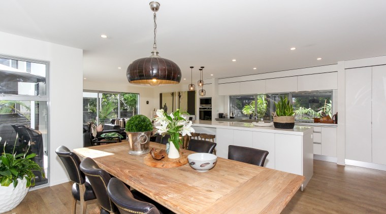 This large kitchen connects to the homes open-plan countertop, dining room, interior design, kitchen, property, real estate, gray, white