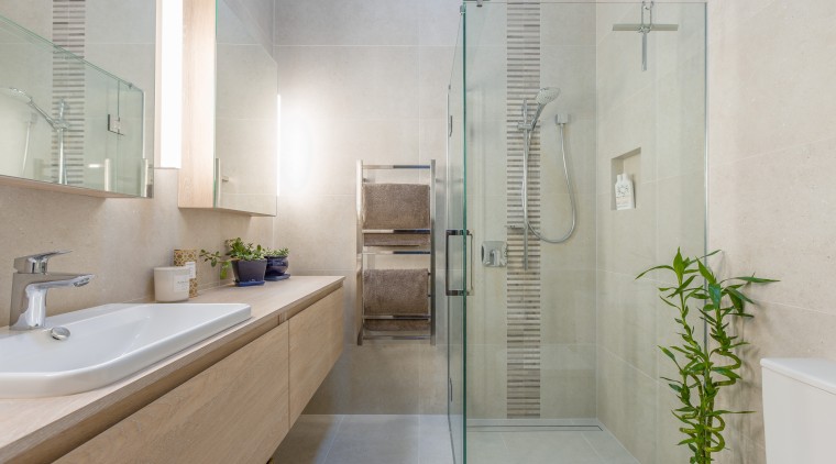This light-filled master ensuite was created as part bathroom, floor, home, interior design, plumbing fixture, product design, room, tile, gray