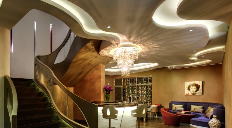 Never mind the arresting ceiling and staircase, even architecture, ceiling, home, interior design, lighting, lobby, room, stairs, brown